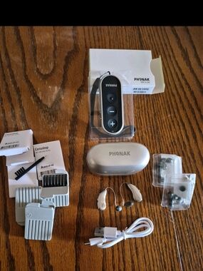 Silver Hearing Device Remote and Accessories